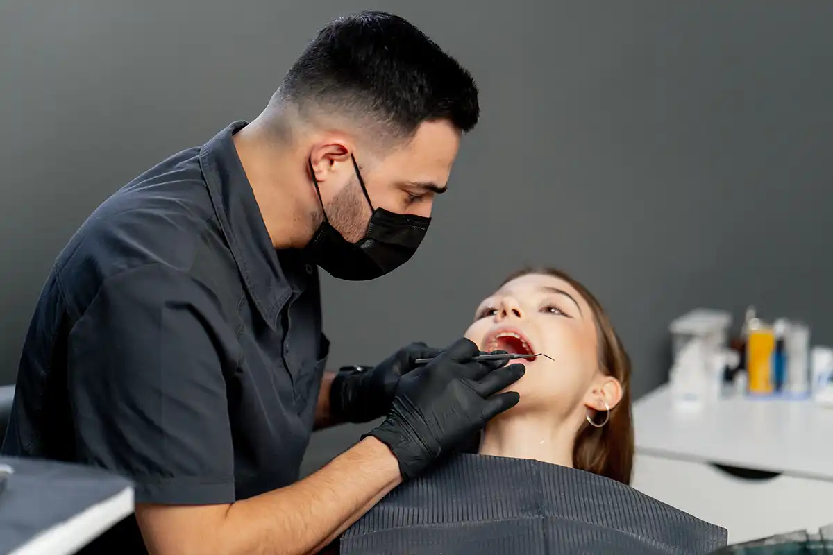 Cosmetic dentist providing smile makeover at a dental clinic in Business Bay